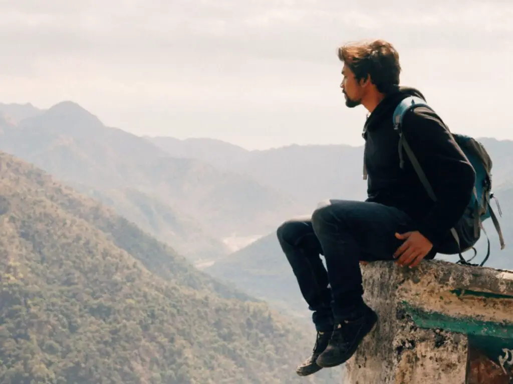 backpacker on top of cliff